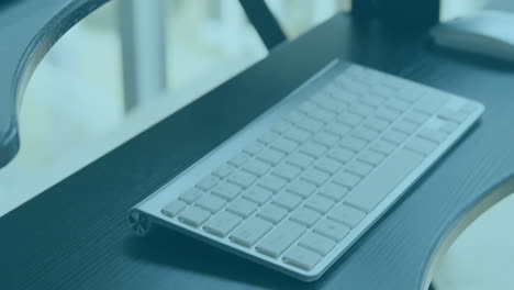 Animation of increasing percentage against close up view of office desk