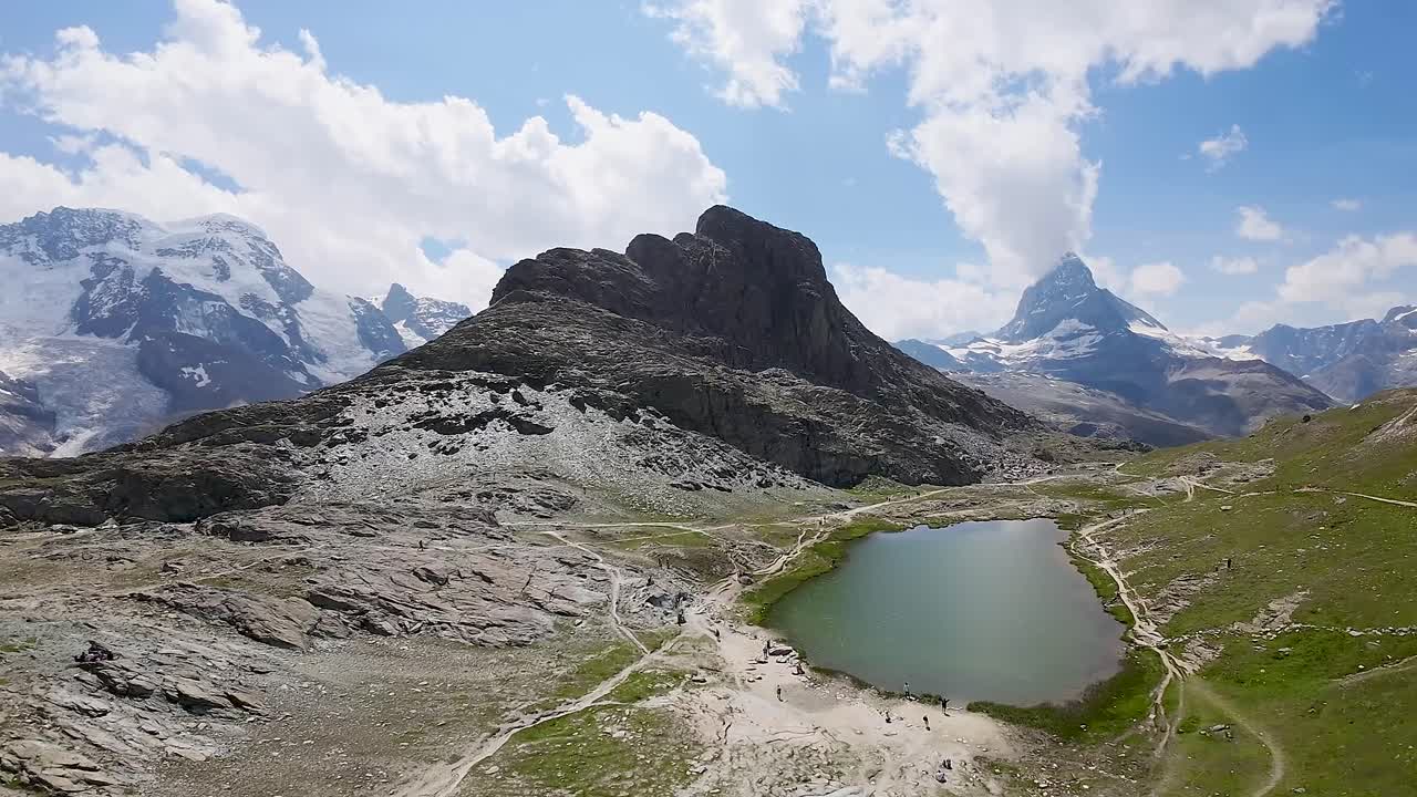 Beautiful panorama of Matterhorn and the Riffelsee lake with the reflection and clouds in Swiss Alps, Switzerland, Europe