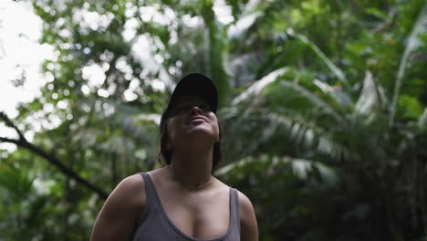 slow motion shot of a tourist spinning admiring the jungle in puerto rico