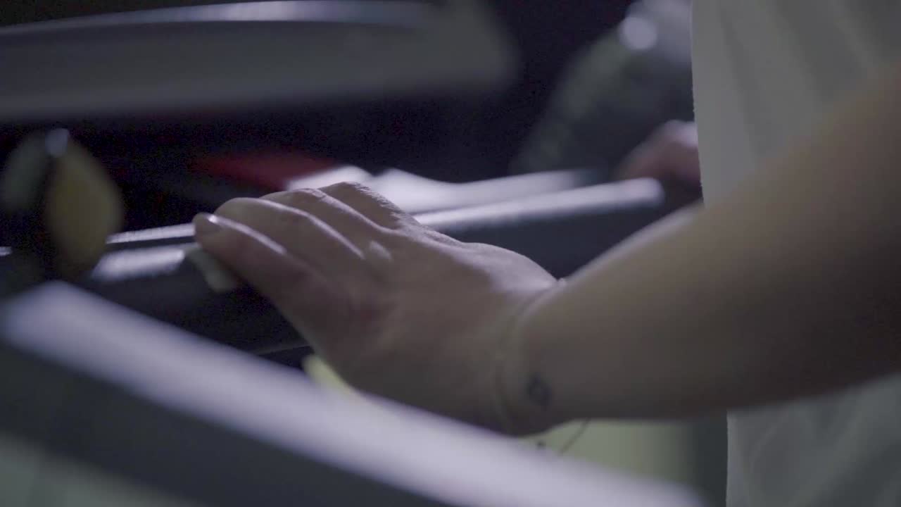 female hands on treadmill inside hotel gym