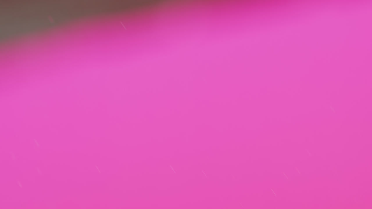 animación de burbujas que se mueven sobre un fondo rosa con espacio de copia