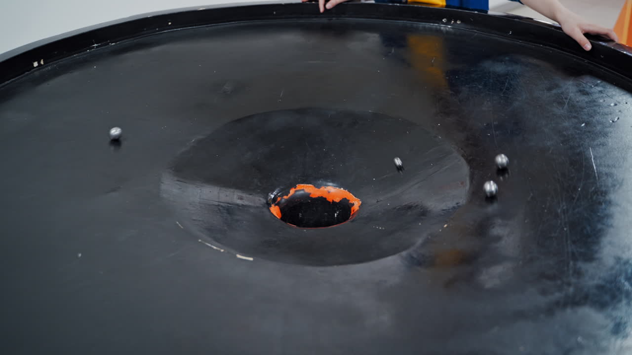 Boy in the museum science. Gravitational field model of black hole