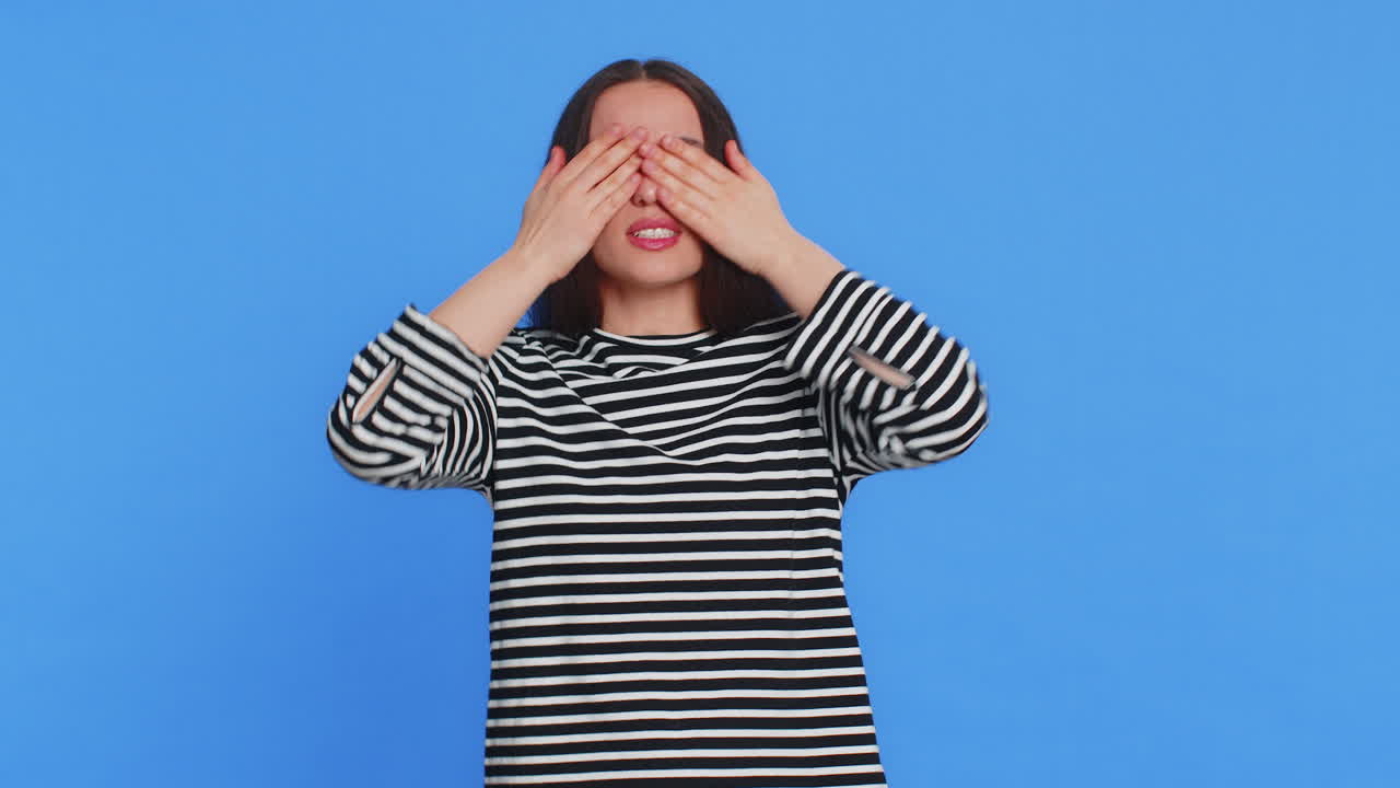 Afraid shocked young woman closing eyes confused shy scared reject to watch phobia shame stress