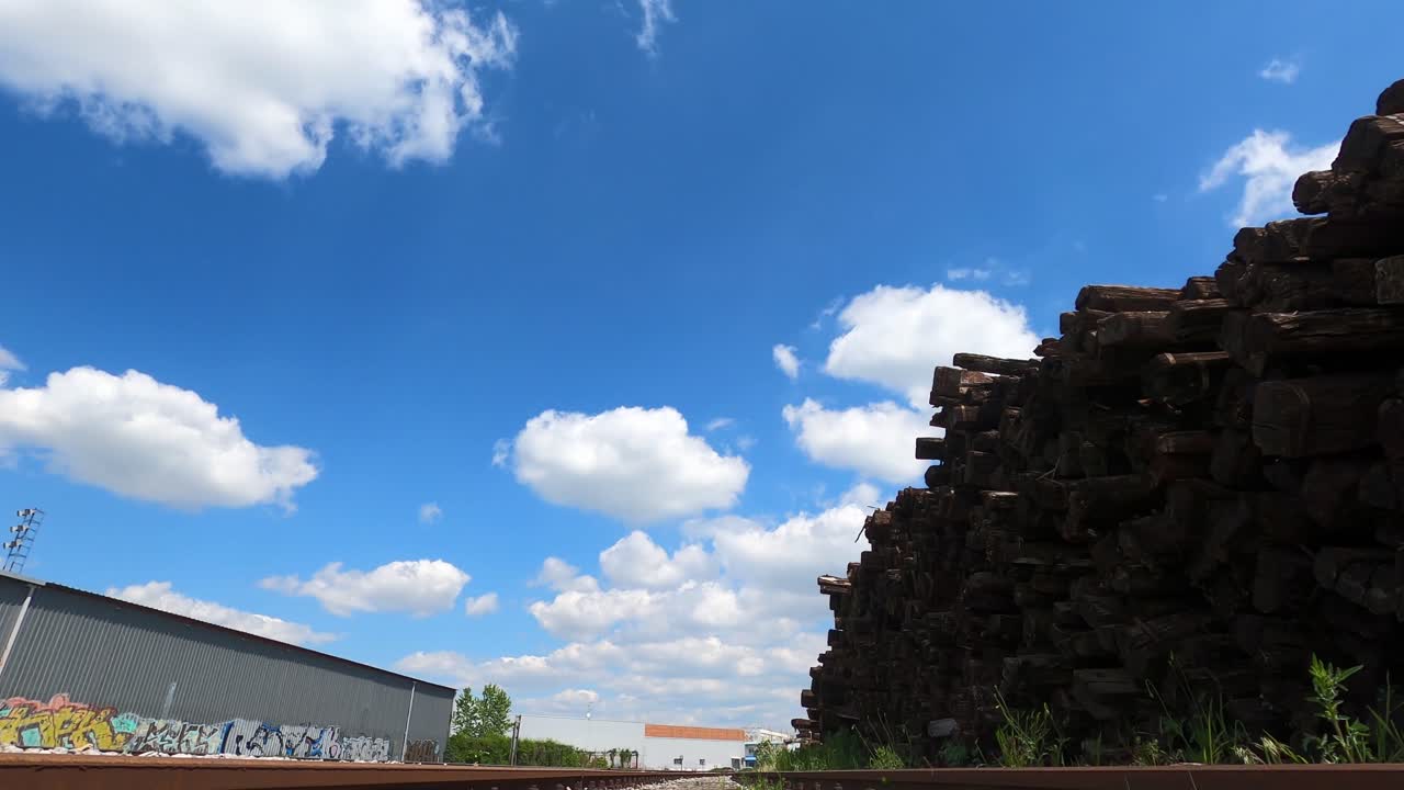 Train view of the rails , graffiti on the wall and sleepers for railways  OSIJEK , CROATIA