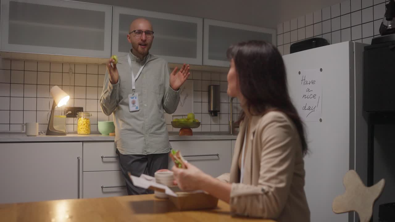 People having lunch in the office kitchen