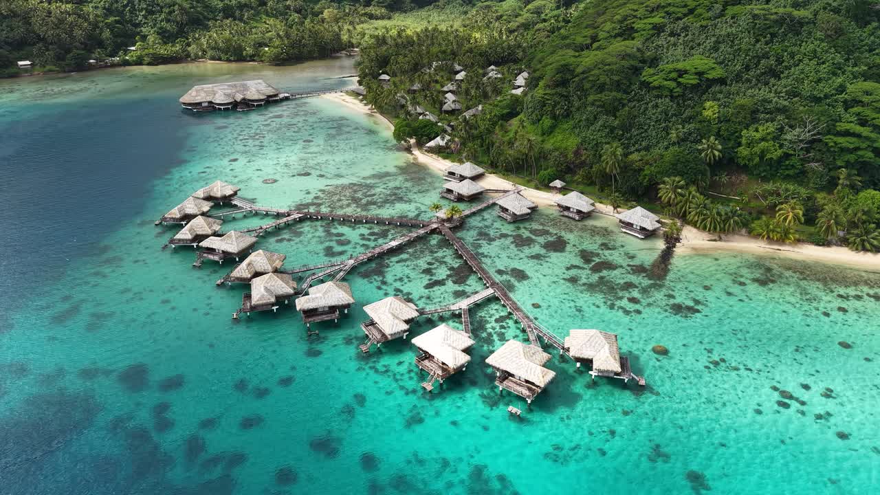 Aerial View of Overwater Bungalows of Luxury Tropical Resort on Huahine Island, French Polynesia