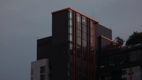 Modern-Condominium-Skyscraper-Close-Up-in-Downtown-Bangkok-with-Timelapse-of-Clouds-Drifting-Overhead