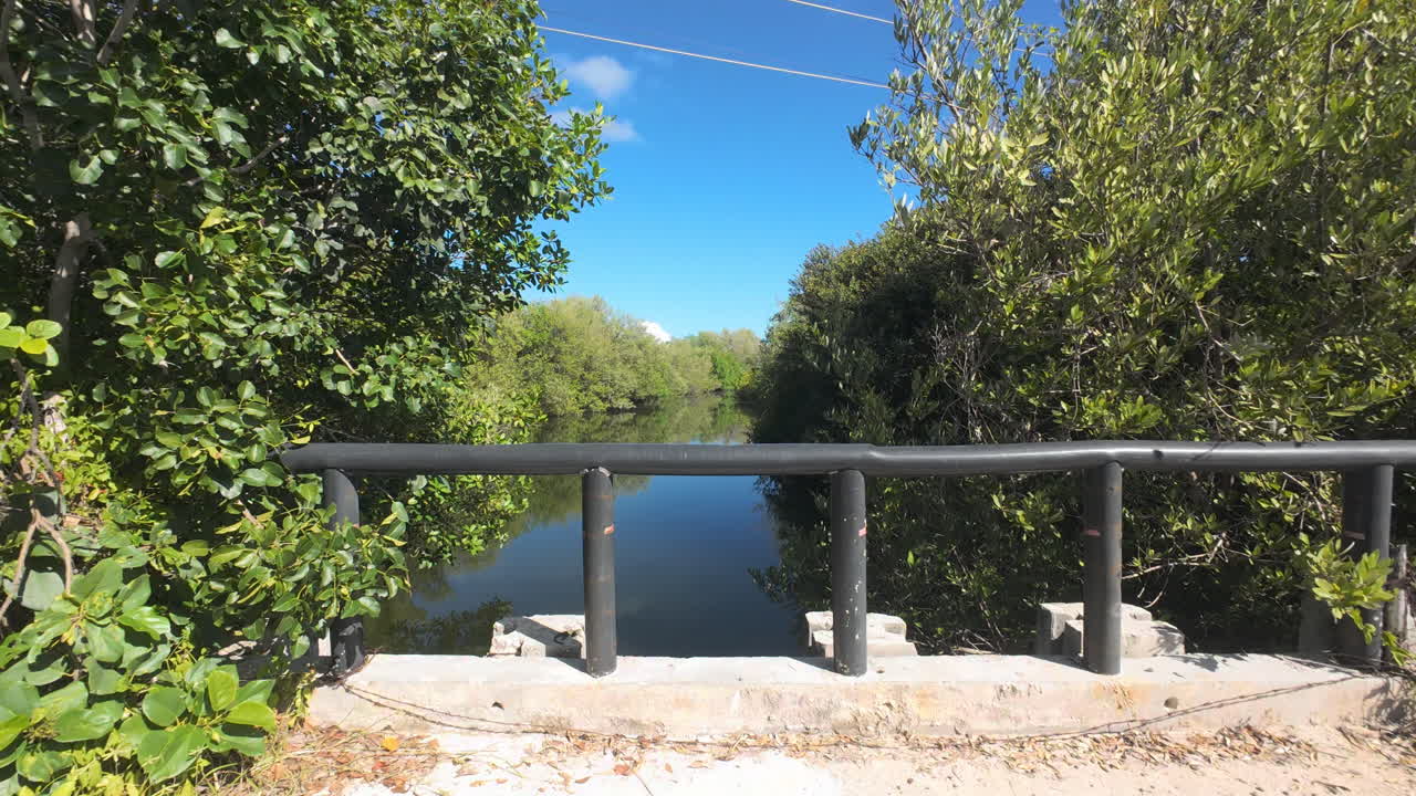 Sisal Travel and Coastal Development. Dynamic video sequence showcasing the vibrant lifestyle and real estate growth in Sisal, Yucatán. Bridge and Lake
