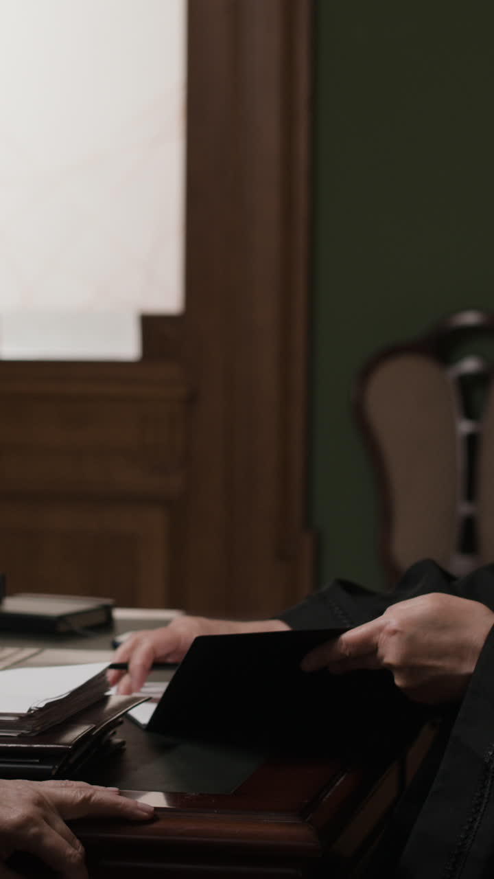 Judge Reviewing Documents in Courtroom