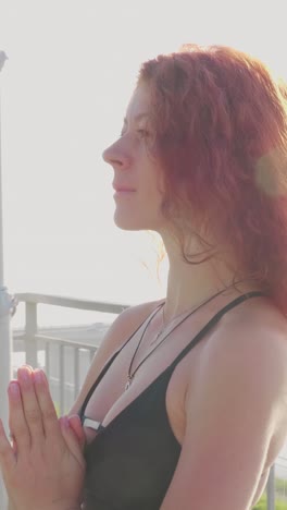woman with wavy hair gazing thoughtfully into the distance, illuminated by soft sunlight glow