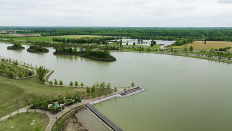 Shelby-farms-park-with-lush-greenery-and-multiple-lakes,-memphis,-tennessee,-on-a-cloudy-day,-aerial-view