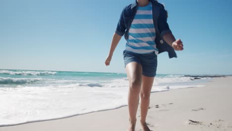 young girl running at the beach