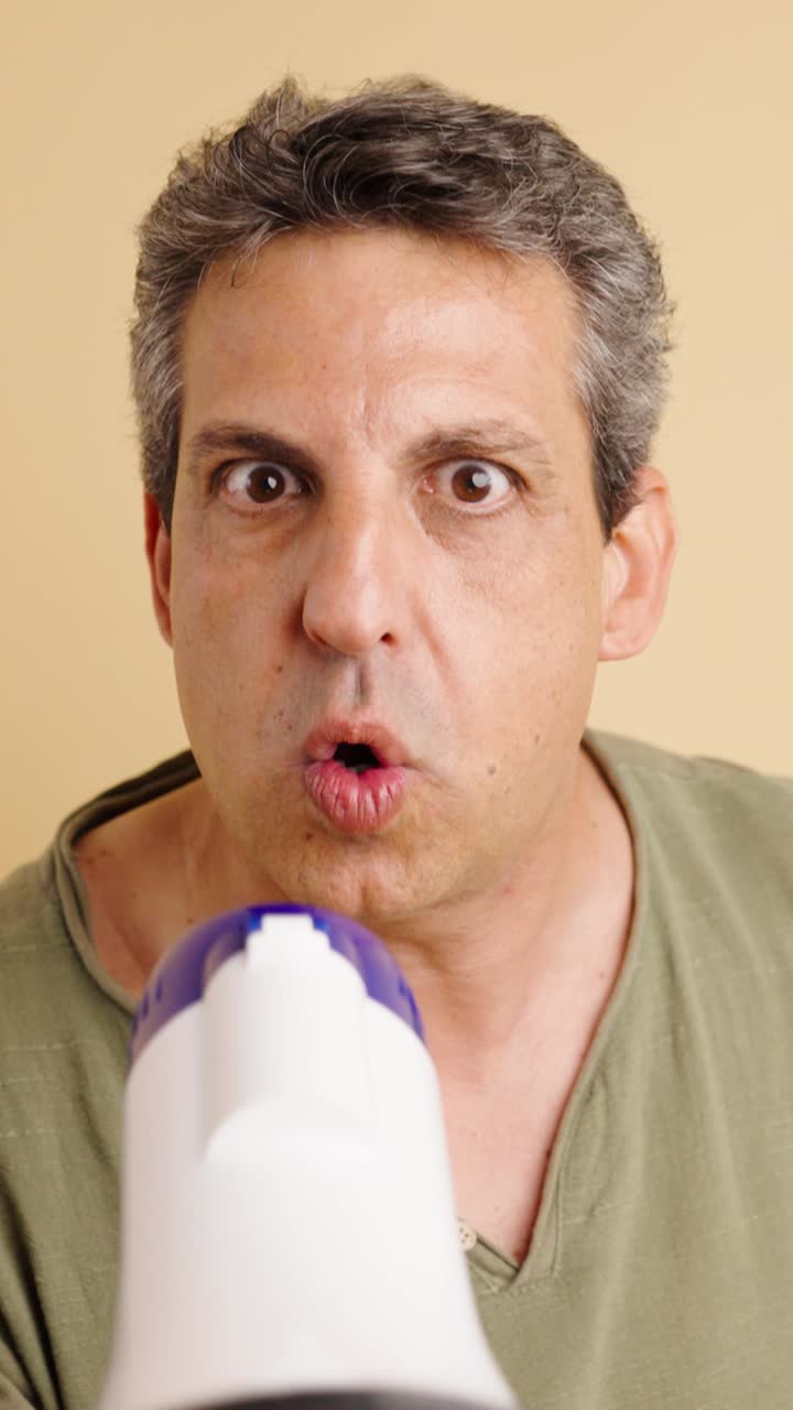Man shouting into a megaphone