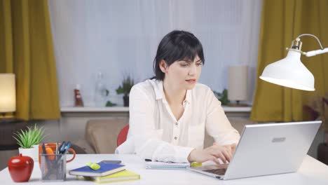 the female student who finishes the homework is happy and peaceful.