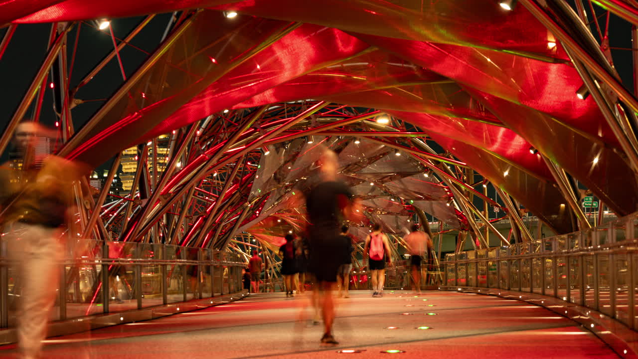 SINGAPORE - 5 MARCH 2025 : timelapse of the helix foot bridge in singapore marina bay at night