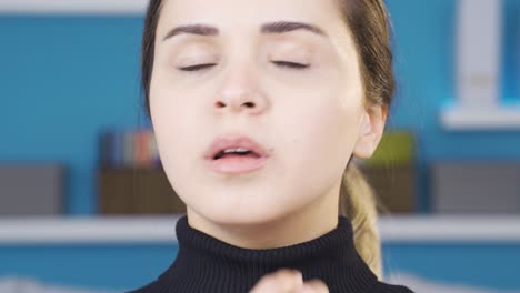 close-up of young woman shrinking and depressed.