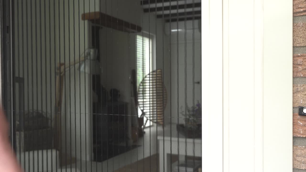 Closing the screen sliding door from the outside