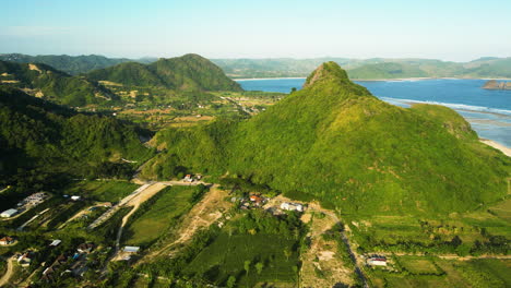 aerial over the area verdant land near torok bay on lombok island, indonesia