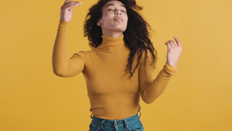 african american woman over orange background.