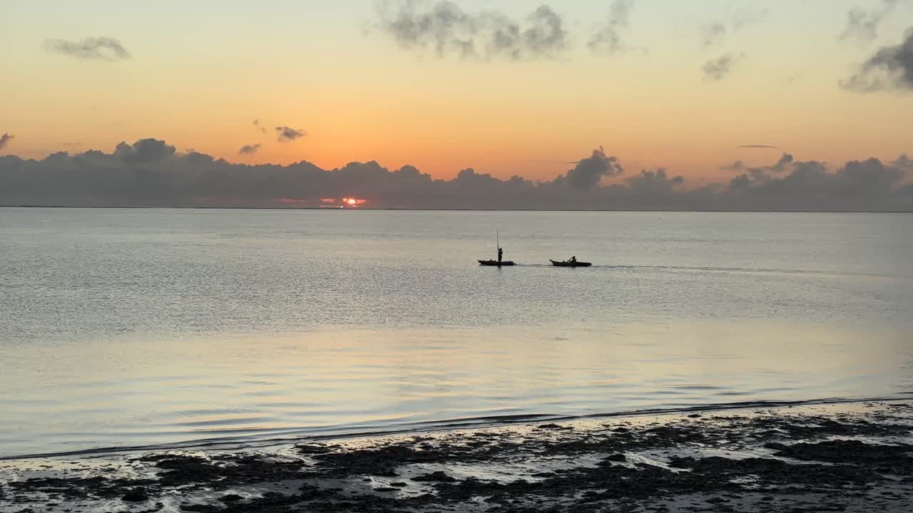 Sunrise Over Paje Beach Zanzibar With Golden Light, Calm Indian Ocean Waves and Colorful Early Morning Sky on the East Coast