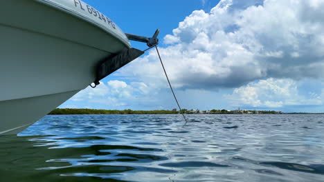 water level view, anchored boat bow floating in ocean, marathon, florida keys