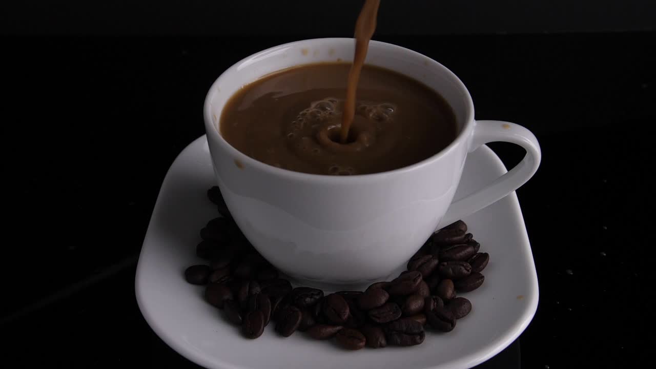 Pouring Coffee into a Cup with Coffee Beans