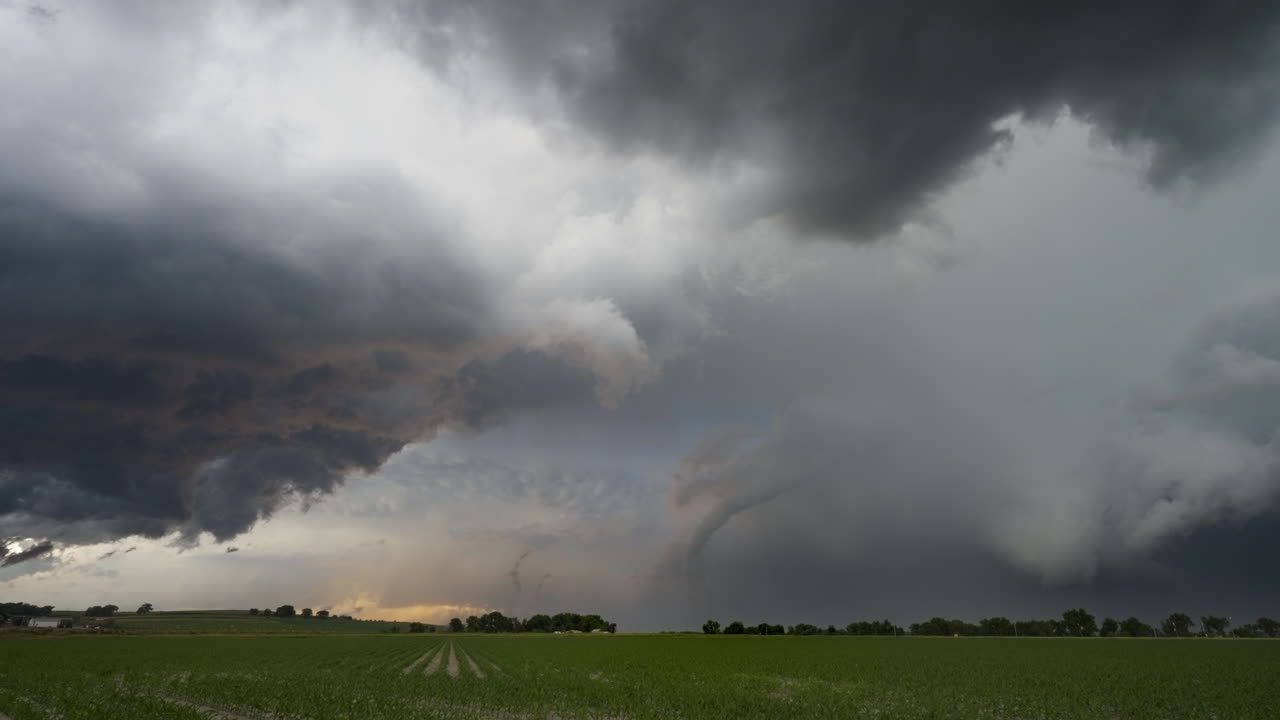 Tornado Starts To Lift As The Sun Sets Over Beautiful Green Farm Land