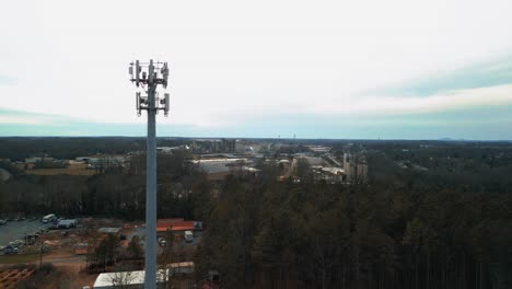 aerial shot flying toward cell phone tower