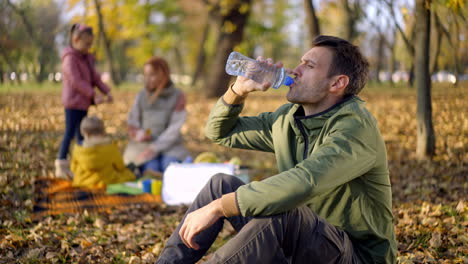 family enjoying a picnic in the park