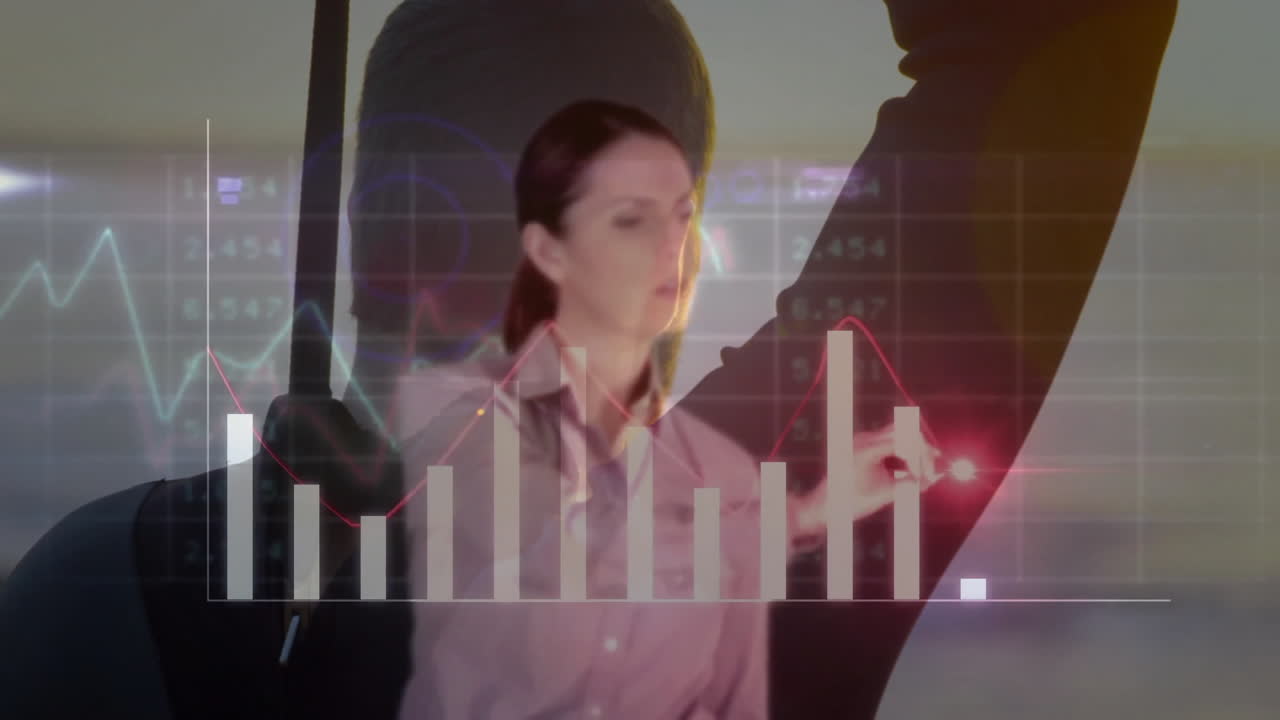 Analyzing financial graphs, businesswoman using animation with digital data in office