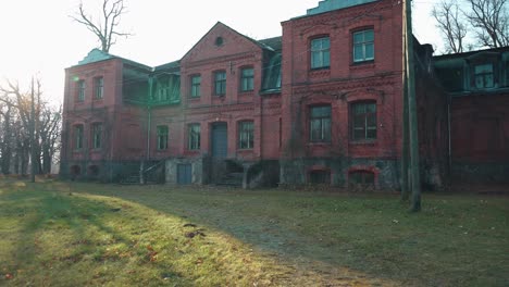 old red brick house, katvari manor in latvia