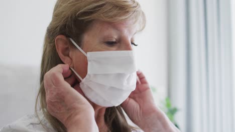 Senior-woman-wearing-face-mask-at-home