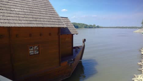 bow of ship mill tied to bank of the danube river in baja, hungary