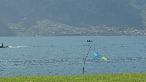 windsock in paraglider landing zone shows lake shore breeze direction
