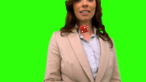 businesswoman throwing a die on green screen