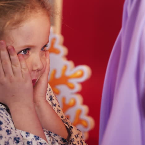 little girls scare each other. emotions of the child. studio shooting of children