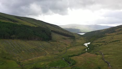 landscape of glen douglas valley in scottish highlands, near loch lomond - aerial drone shot