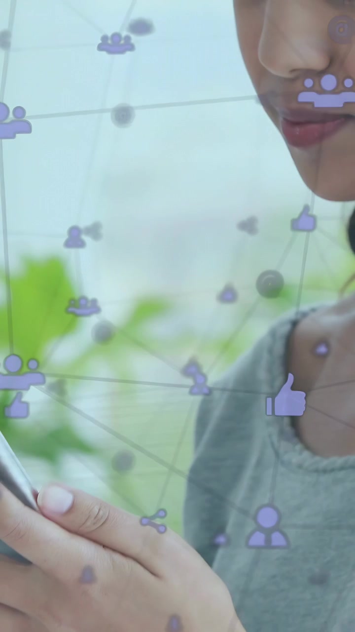 Vertical video: Woman tapping phone, starting social media icons, smiling while engaging with feed