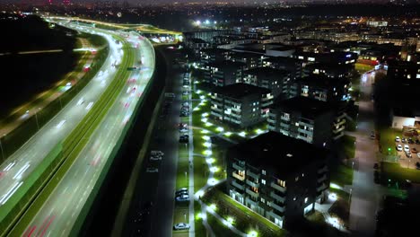 Hyperlapse-or-Dronelapse-Aerial-view-of-Highway-road-next-to-City-Warsaw,-Wilanow