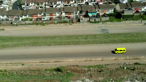 descend aerial of residential district beside intersection road with cars in summer