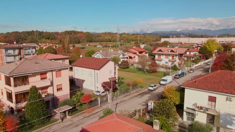 idyllic settlement with beautiful autumn landscape in countryside against blue sky