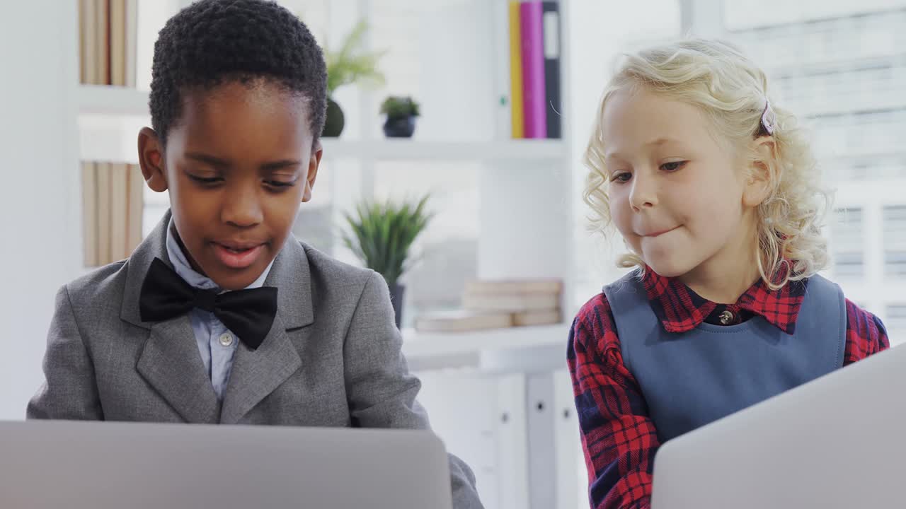 Kids as business executives discussing over laptop 4k