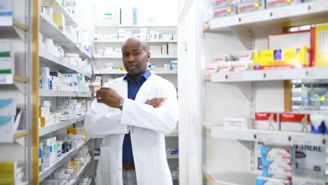 a-male-pharmacist-looking-at-products-on-the-shelf