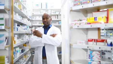 a male pharmacist looking at products on the shelf