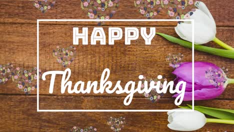 Animation-of-happy-thanksgiving-text-in-frame-over-flowers-and-floral-pattern