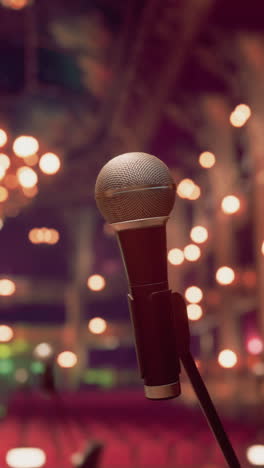 microphone on stage with blurred background lights