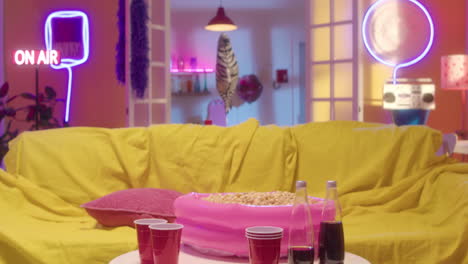 man watching movie with popcorn in a retro living room
