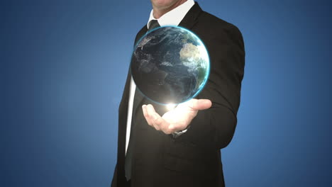 Businessman-holding-digital-generated-globe