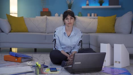 home office worker woman looking dull at camera.