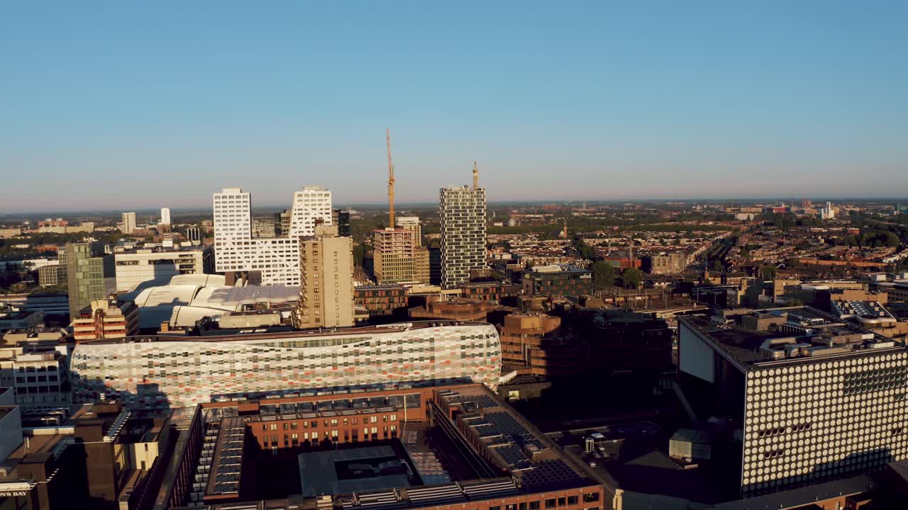 Aerial view of Utrecht's city architecture, flyby tivoli, hoog catharijne and the central train station, Netherlands